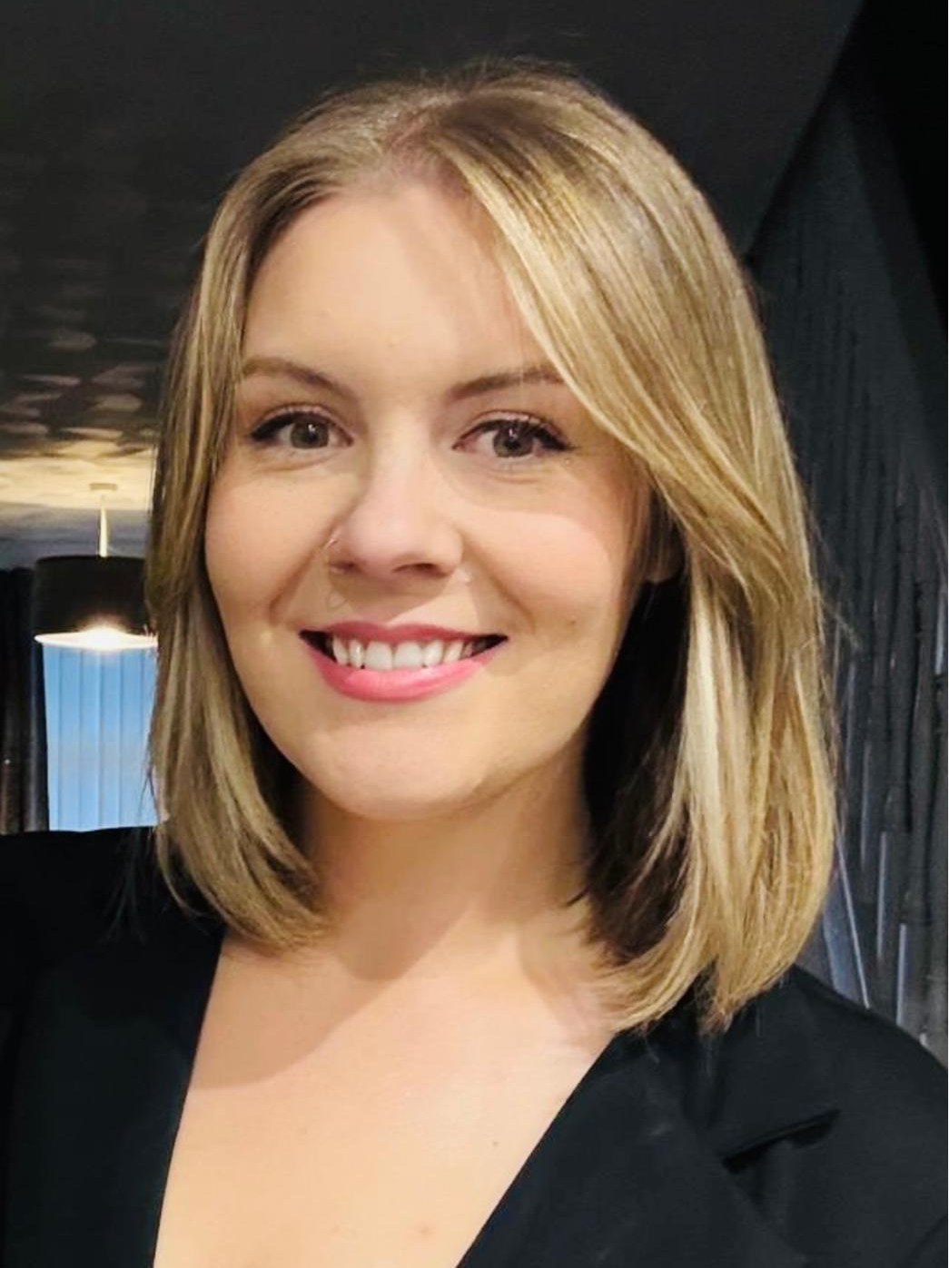 Profile picture of business woman in black dress