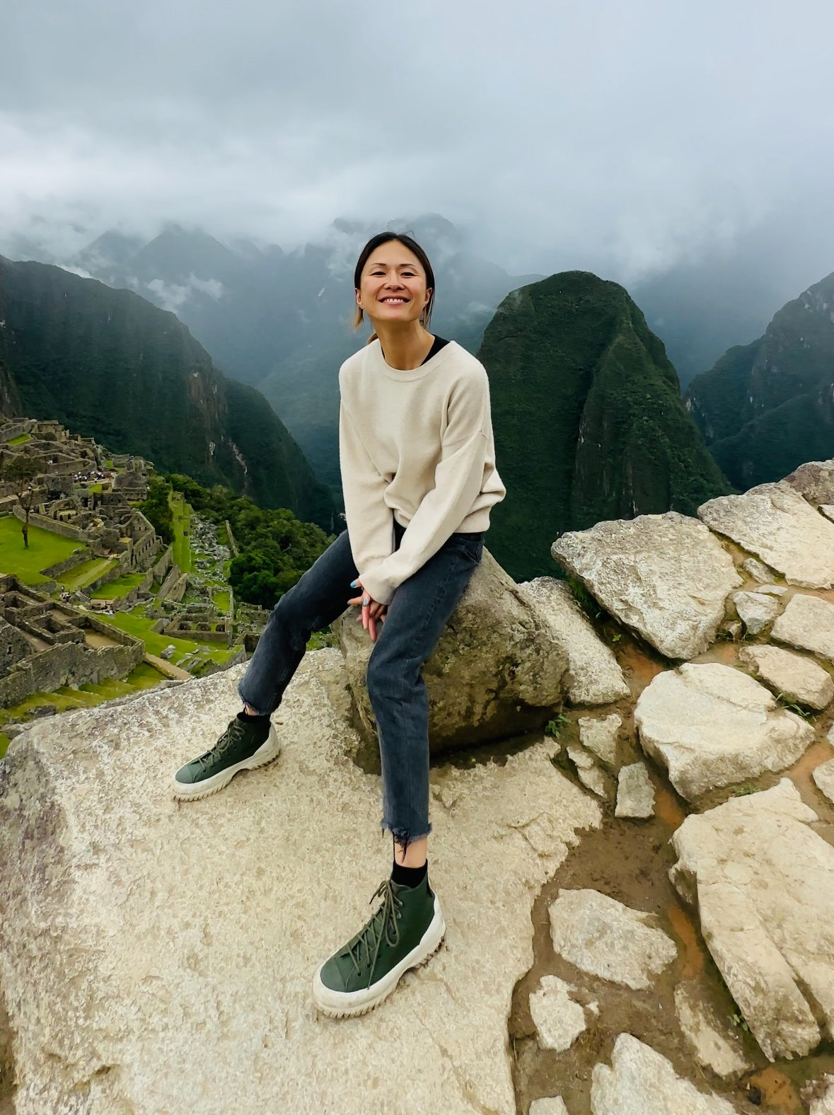 Lady atop Match Pitch with grey skies