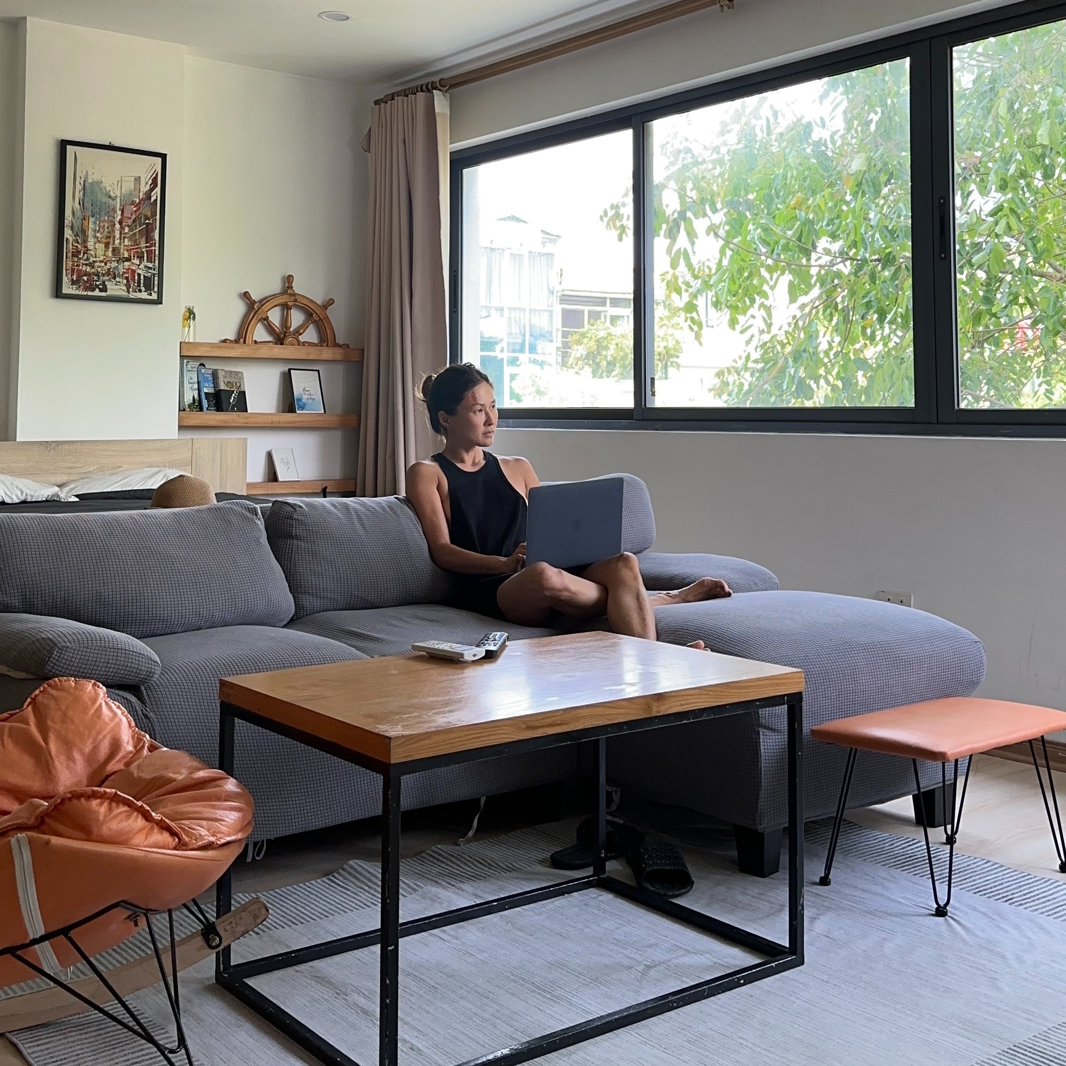 Lady reclining in well lit room
