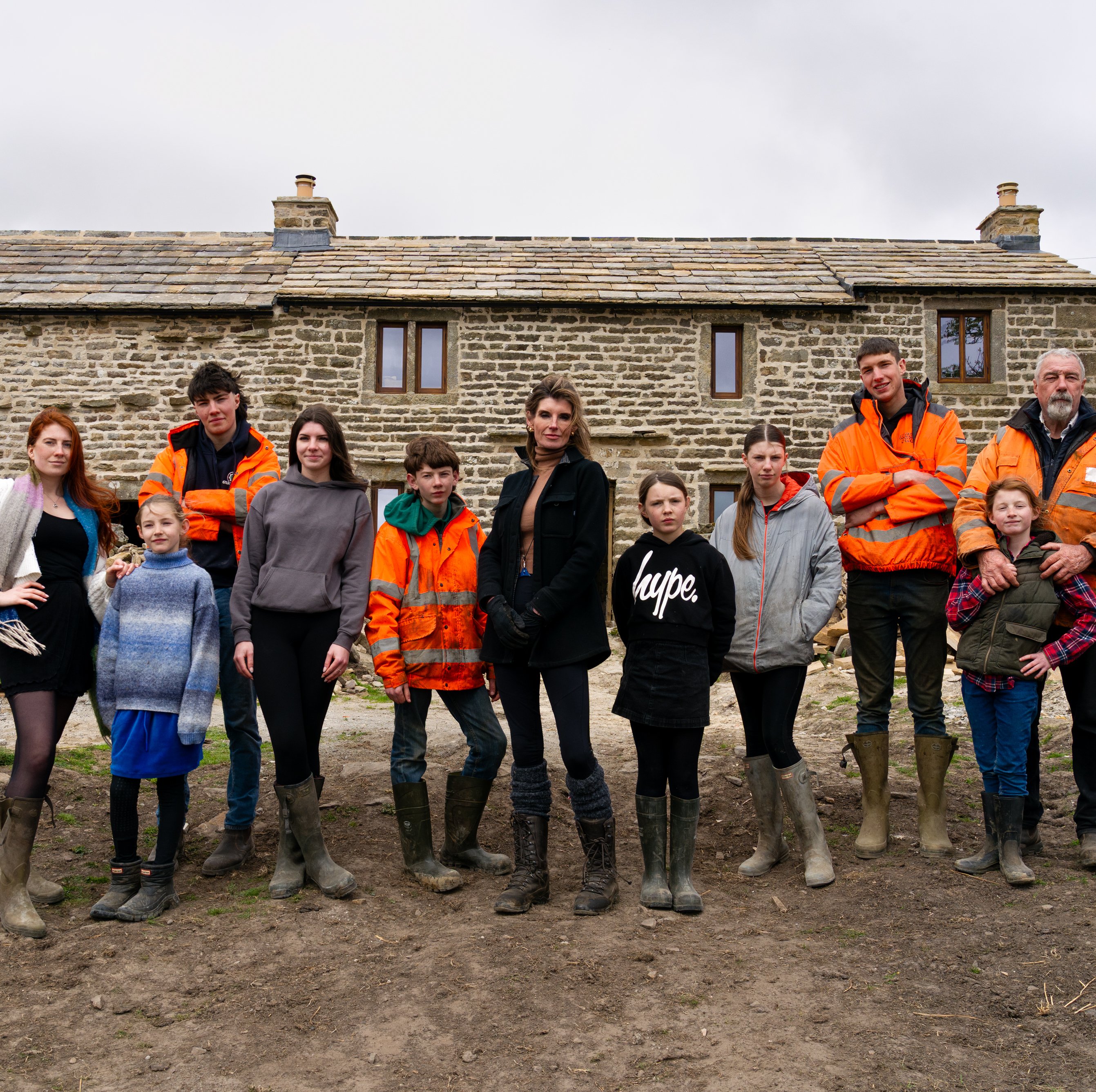 Yorkshire Shepherdess Amanda Owen and her family outside Anty John's, the 200 year old farmhouse they are currently renovating.