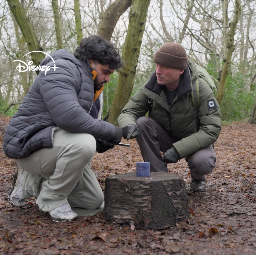 John Hudson teaches Maz Mirzadeh some survival skills. 