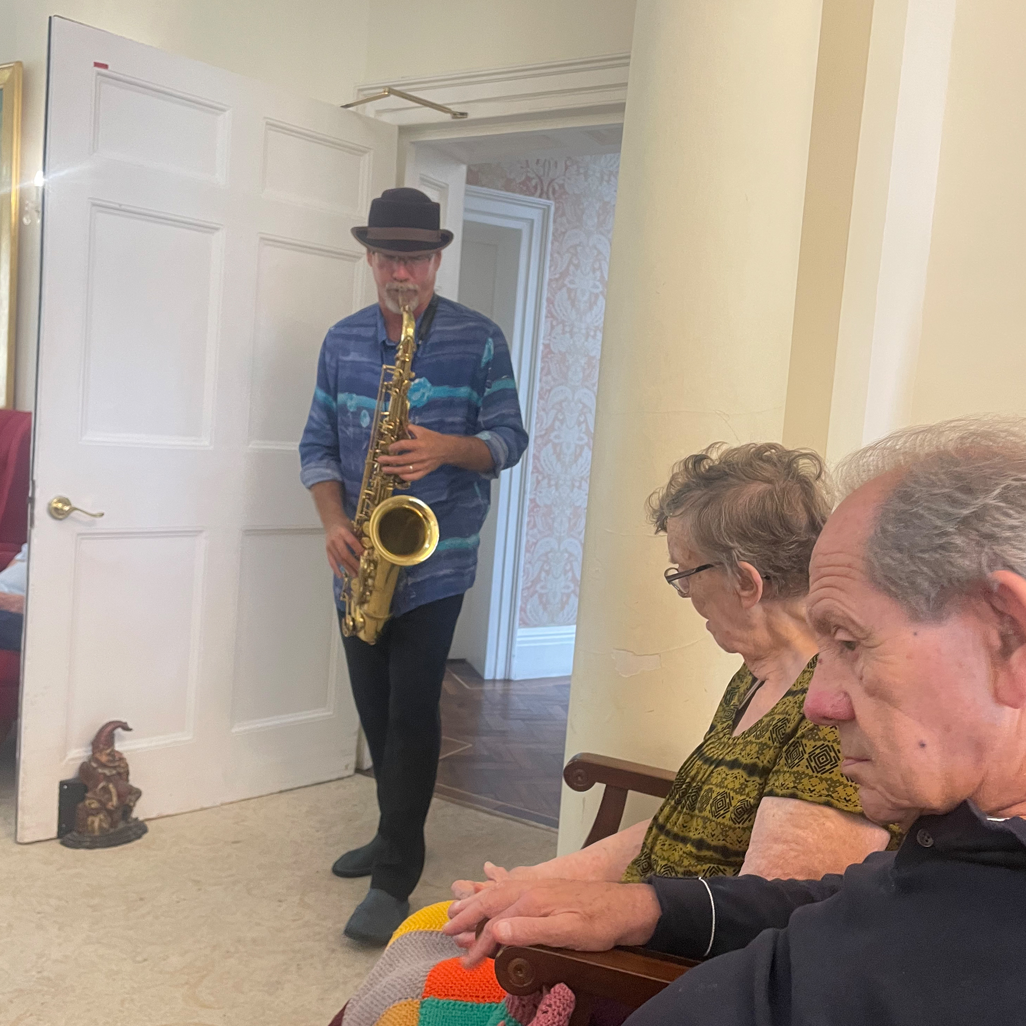 Freddy the saxophonist performs for Blackbrook House residents