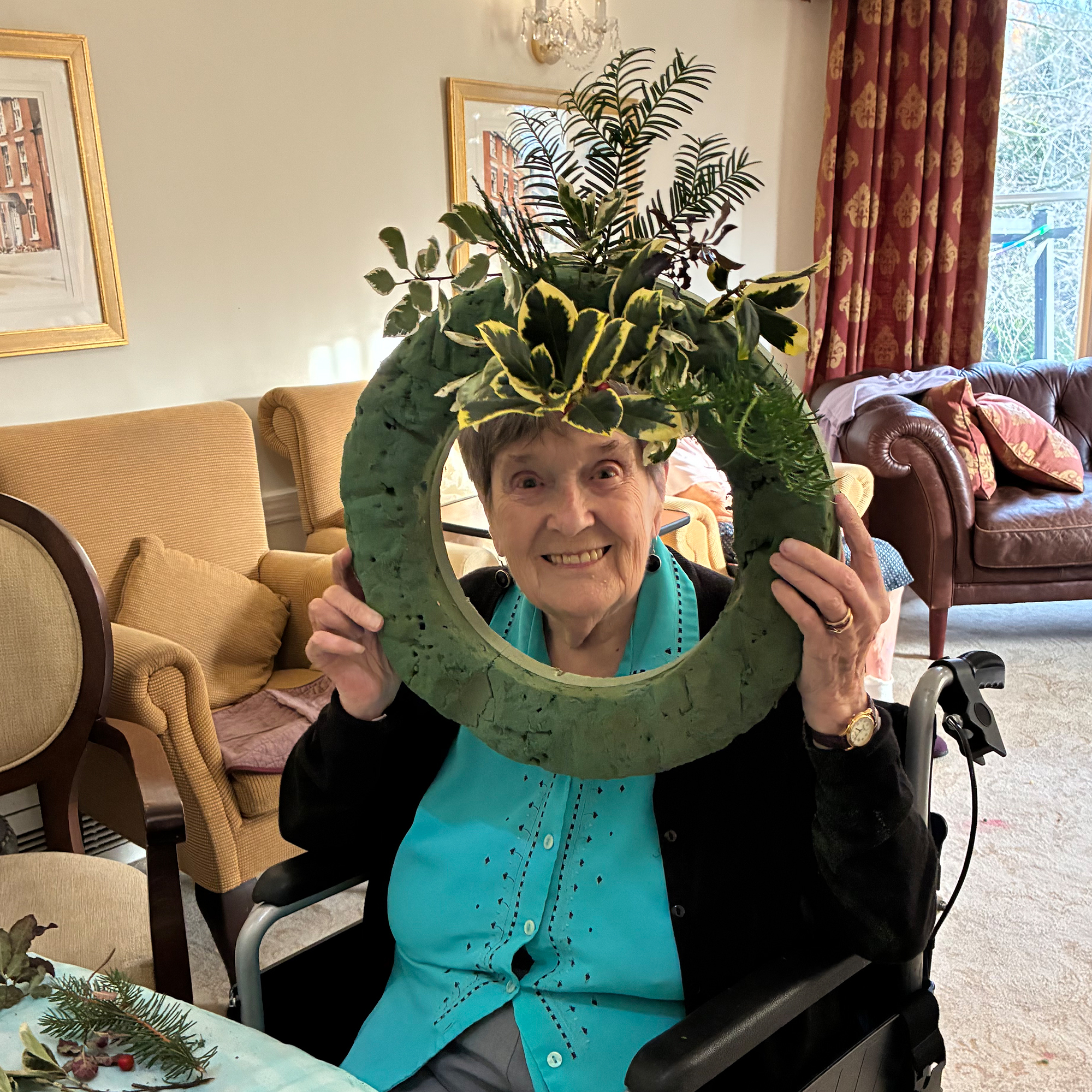 Blackbrook House resident making a Christmas wreath