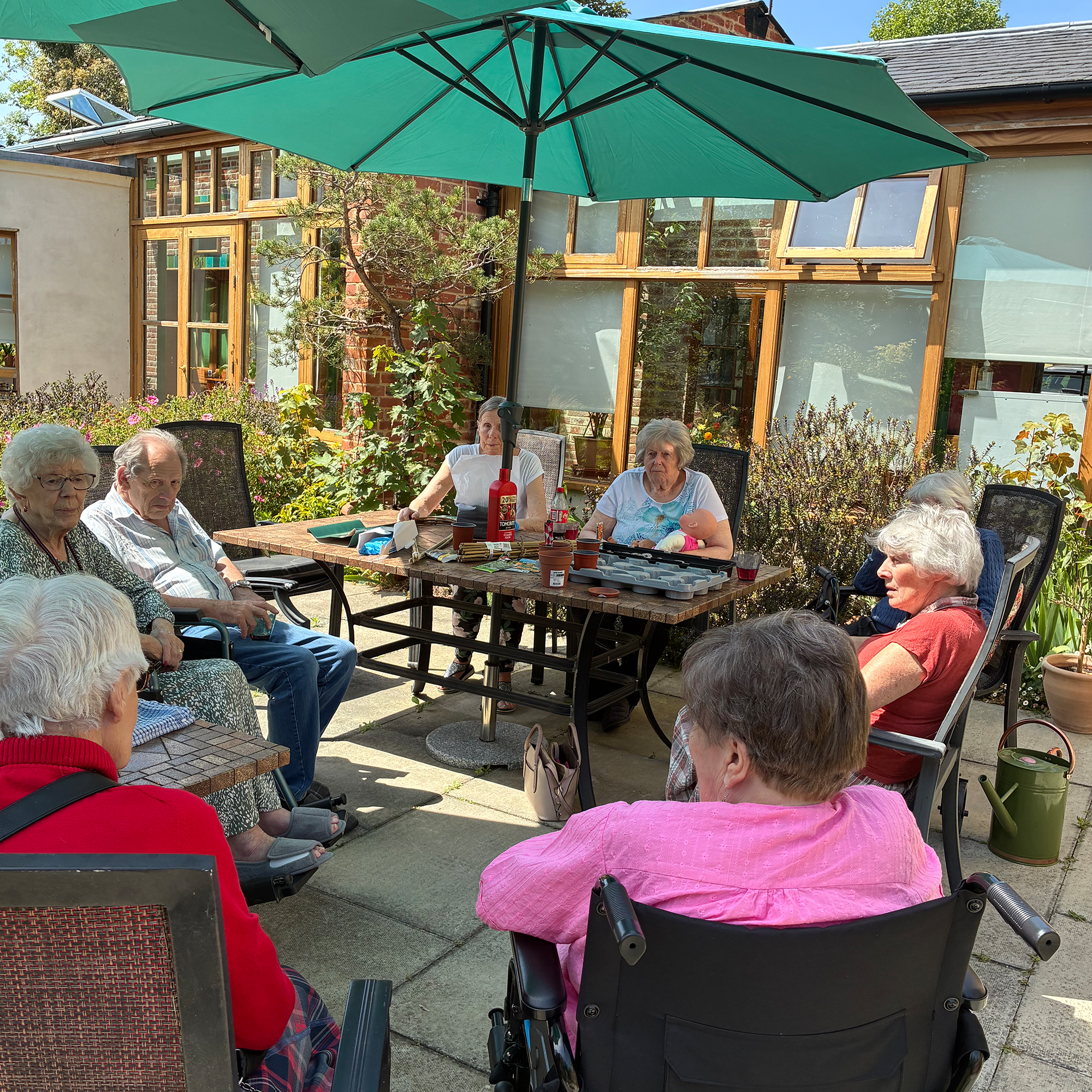Blackbrook House residents enjoying the sunshine in the garden