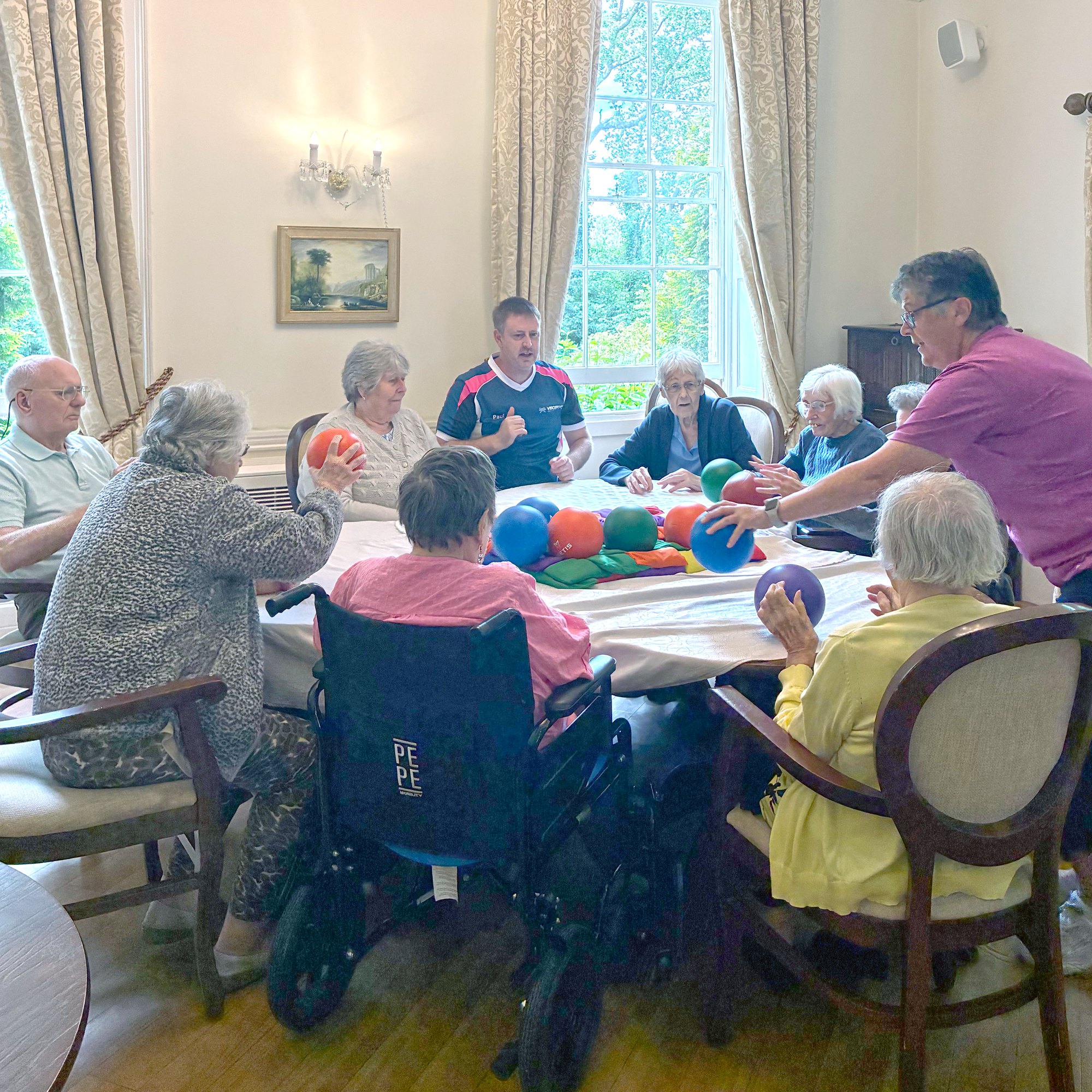 Visosport discuss game play with Blackbrook House residents