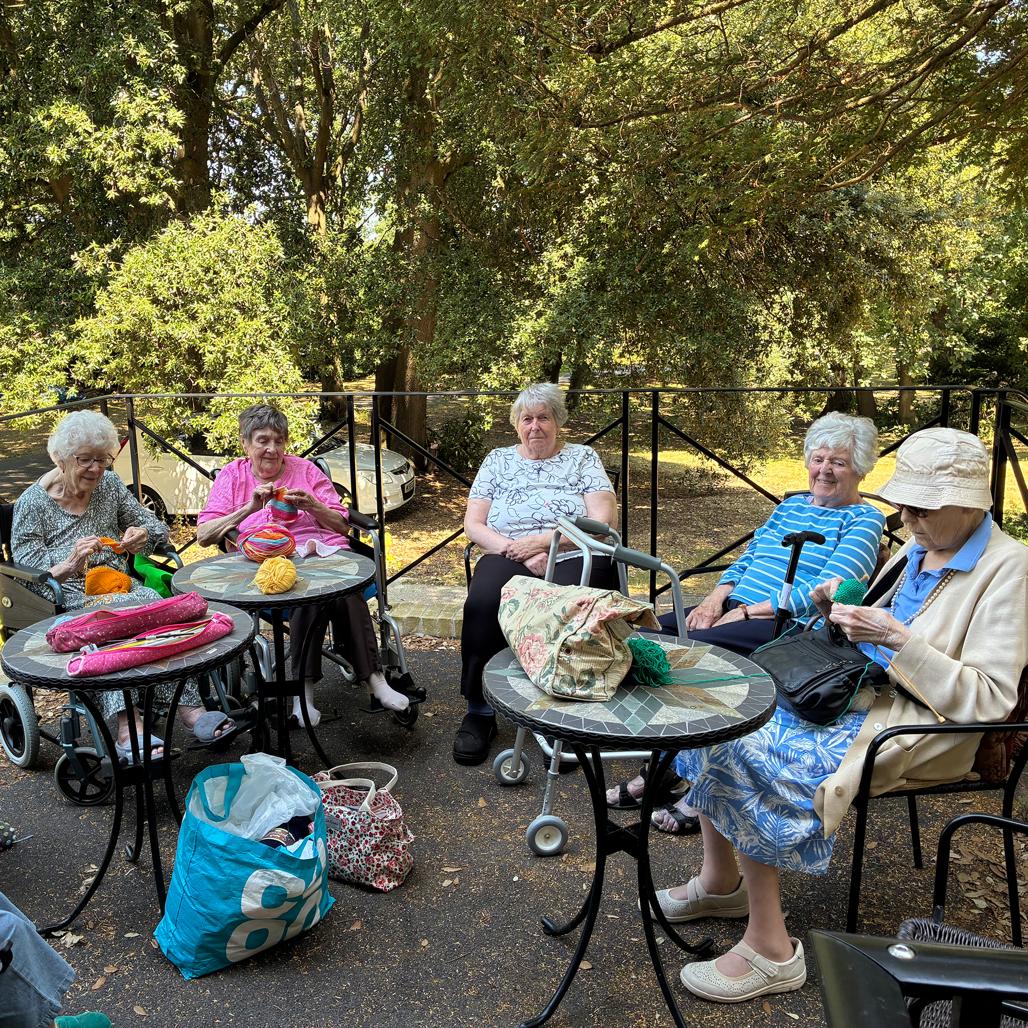 Residents off Blackbrook House Care Home knitting in the landscaped gardens